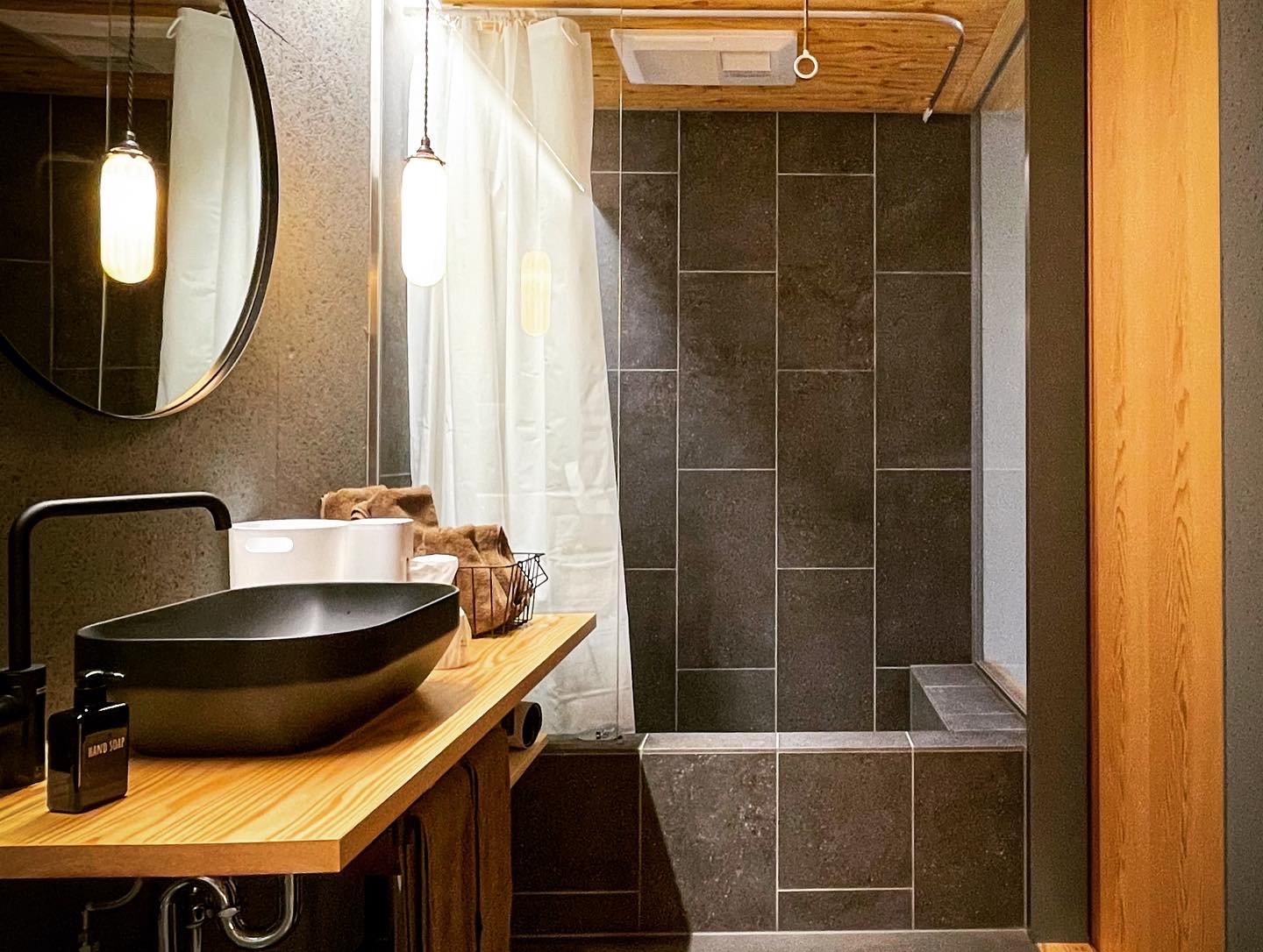 The washbasin and shower of a guest room